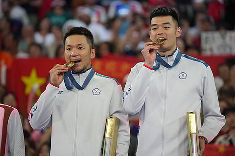 Badminton Men's doubles: Taiwan's Lee Yang, left, and Wang Chi-Lin after winning gold medal
